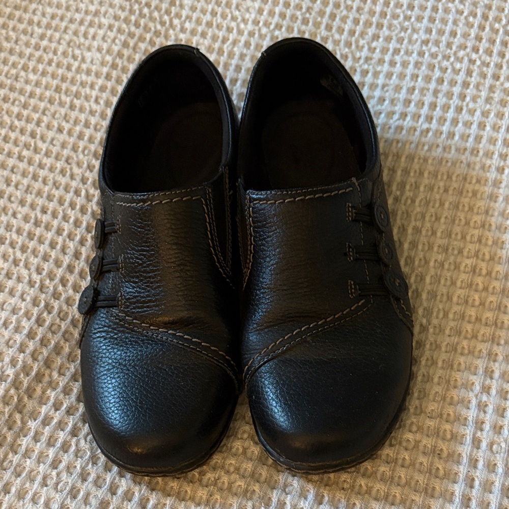 Clarks Black Leather Slip-On Flats with Button Accents